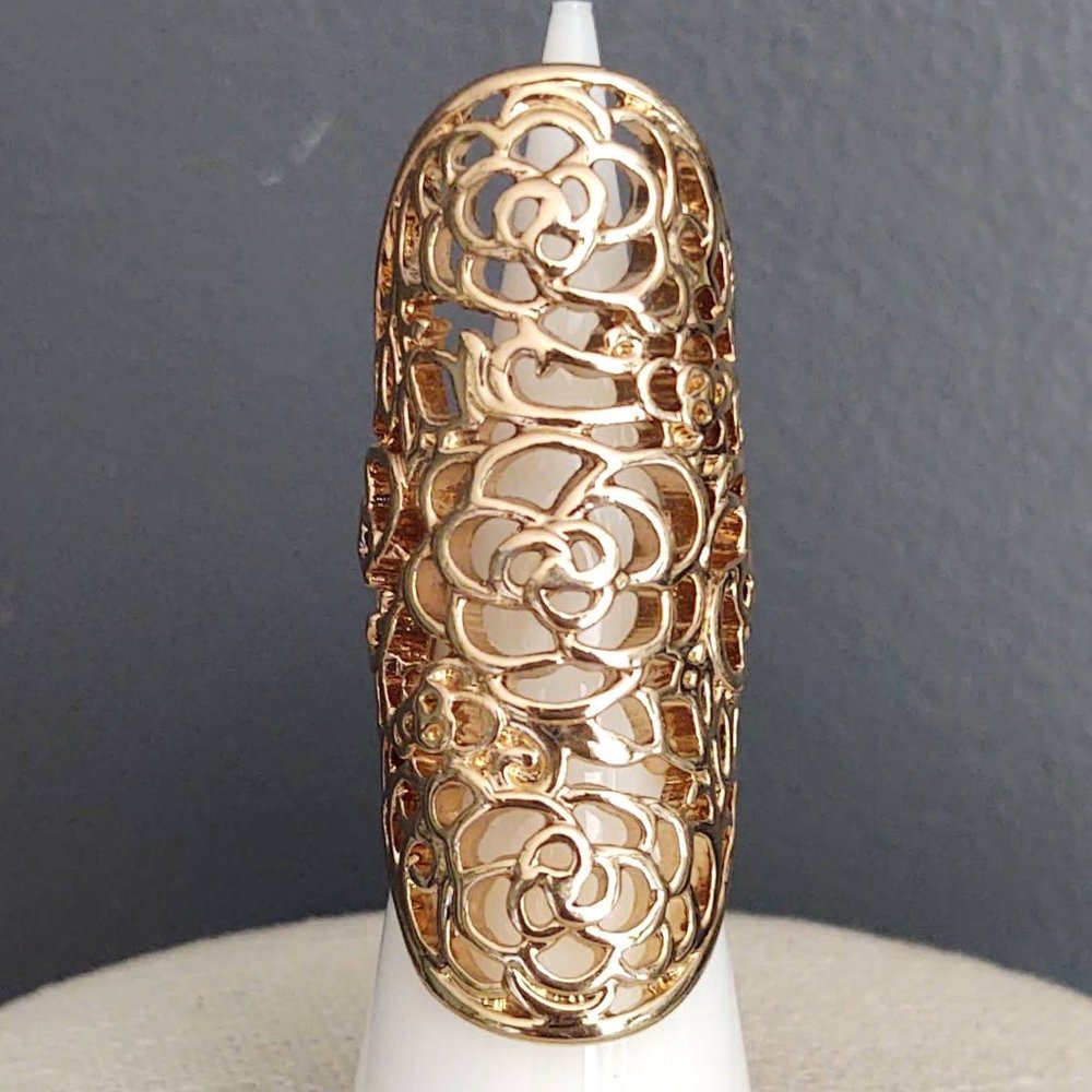 Long, open scroll design gold ring